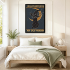 Hello Darkness My Old Friend black cat witch hat gold moon vintage wall art in black frame hanging above neutral linen king bed with wooden nightstands in minimalist American bedroom